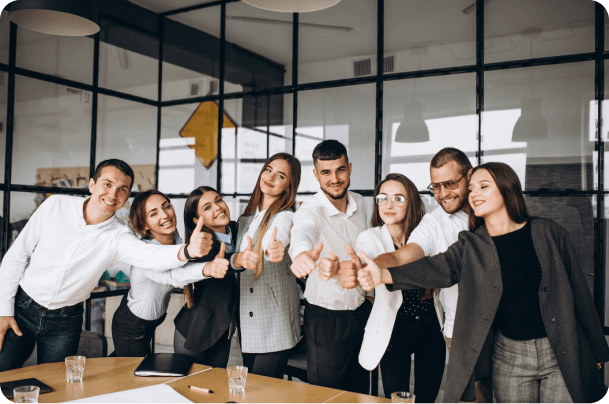 team of helpers giving a thumbs up for their success
